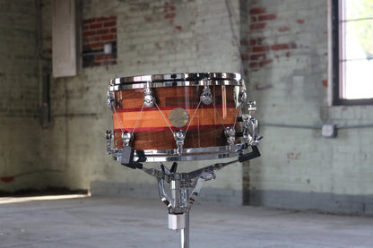 Segmented Bubinga, Purpleheart, and Walnut Snare Drum with high glass natural lacquer and welch tuning system