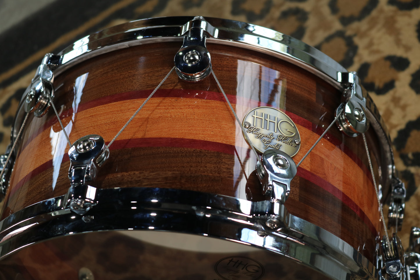 Segmented Bubinga, Purpleheart, and Walnut Snare Drum with high glass natural lacquer and welch tuning system