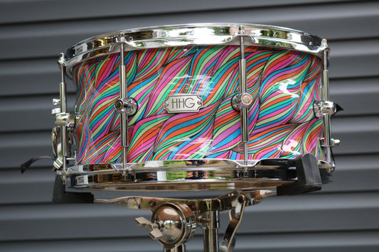 Contoured Maple stave snare drum with laffy taffy high gloss lacquer and Chrome hardware