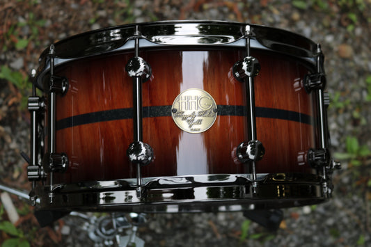 14x7  mahogany stave snare drum with black glass glitter inlay and natural to black burst high gloss lacquer