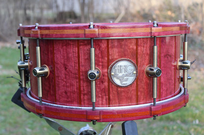 Purpleheart and bubinga stave snare drum with matching wood hoops and antique bronze hardware