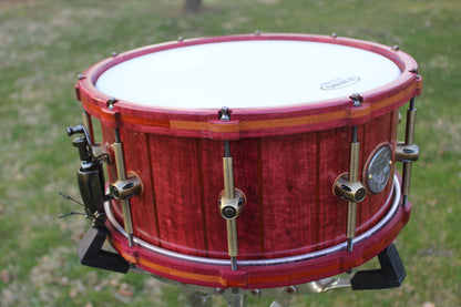Purpleheart and bubinga stave snare drum with matching wood hoops and antique bronze hardware
