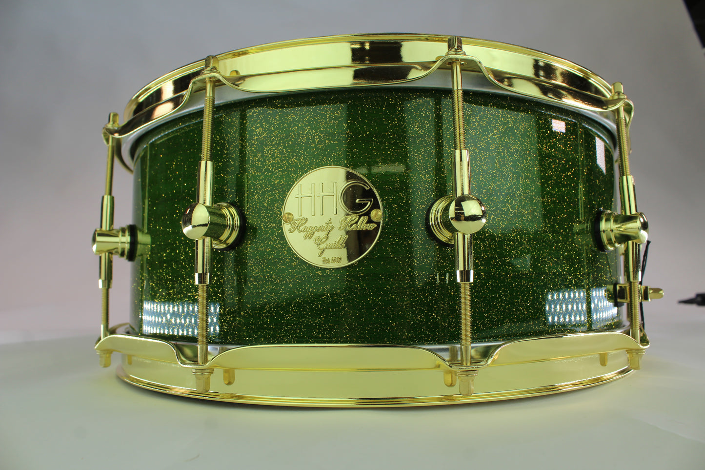 Curly Maple Stave Snare Drum with Green Metallic Flake High Gloss Lacquer & Gold Hardware